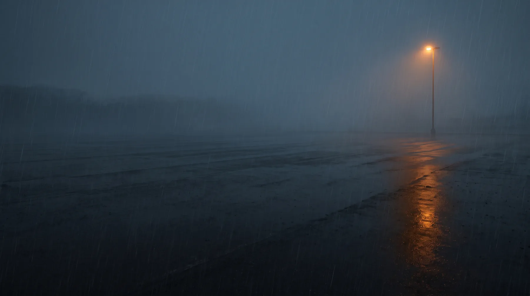 An empty lot at night in fog